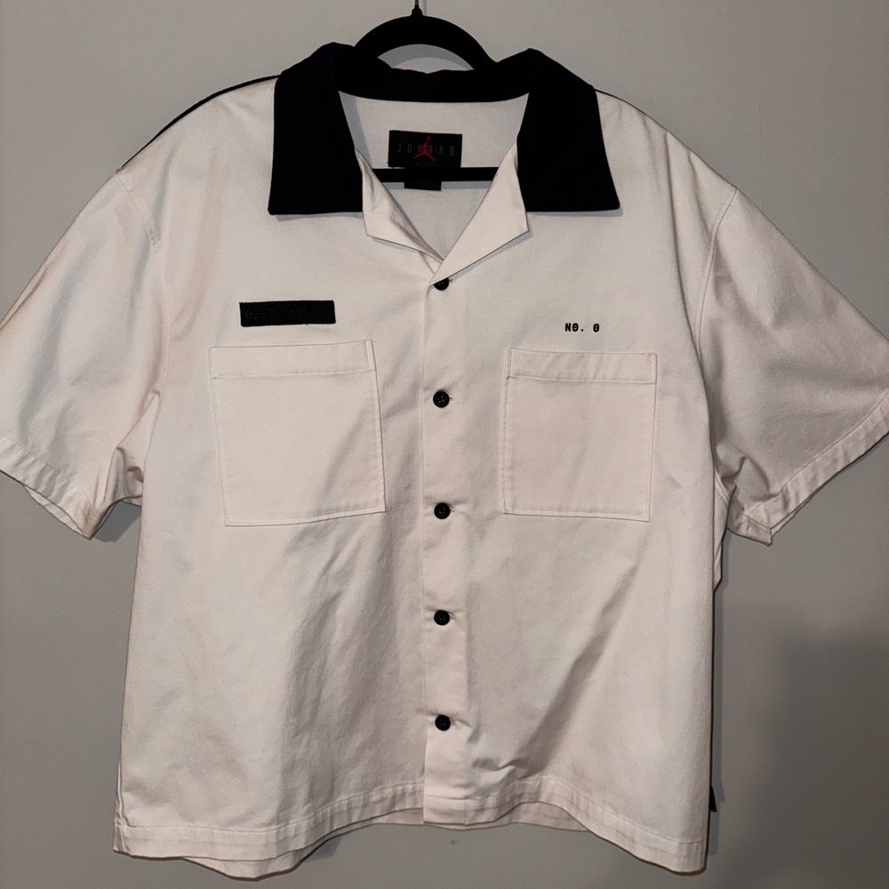 Jordan White and Black Shirt with Red Logo